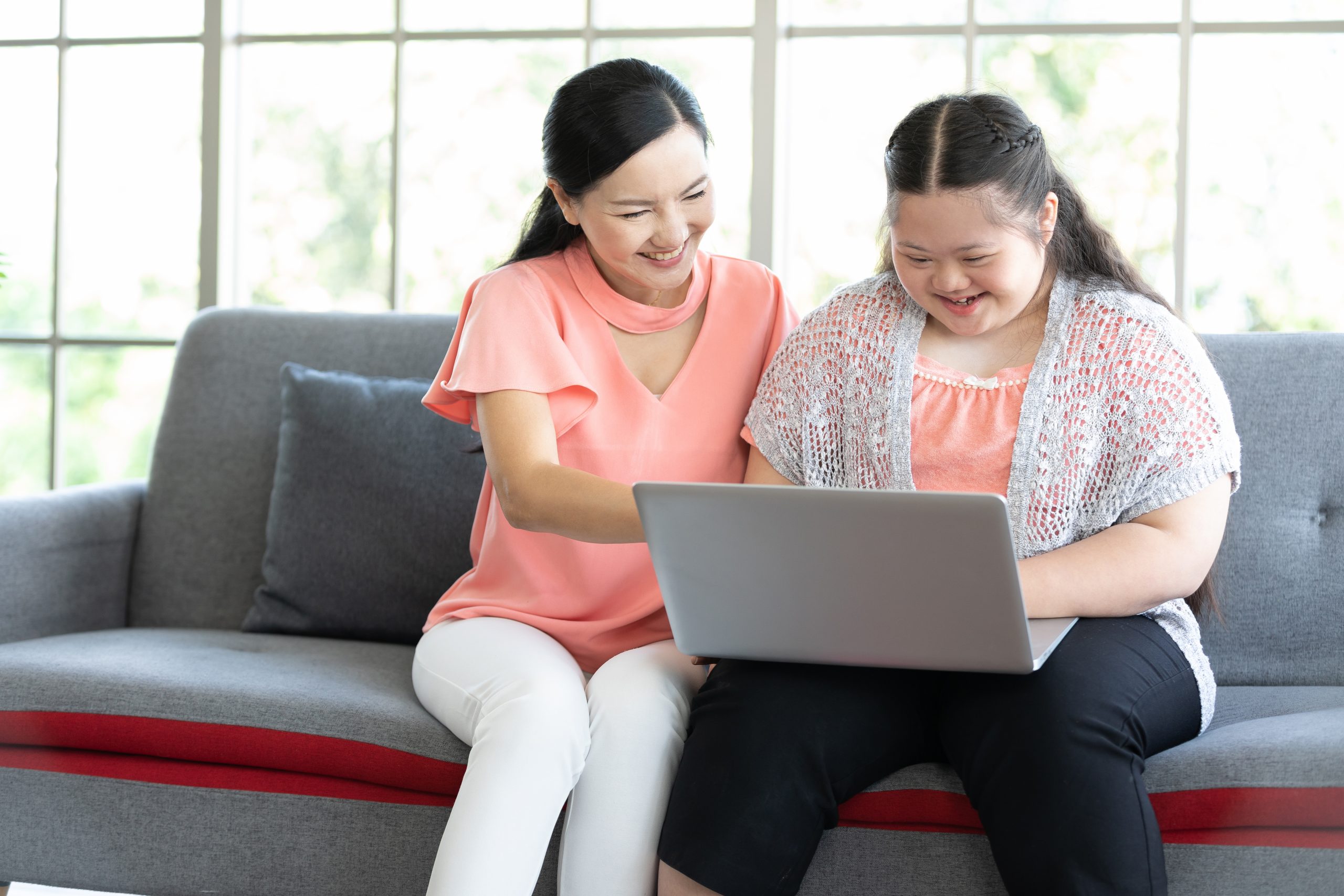 Image of two women looking at a laptop