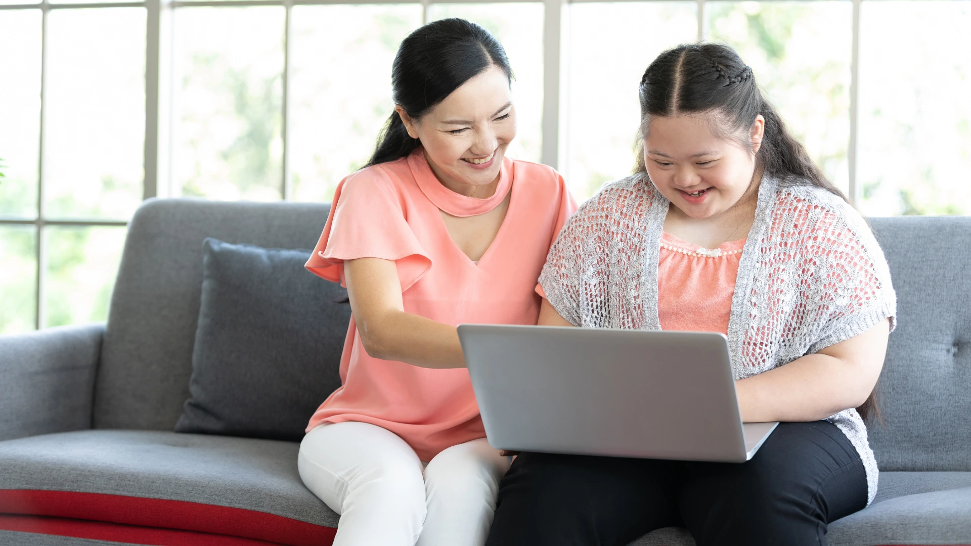 Image of two women looking at a laptop